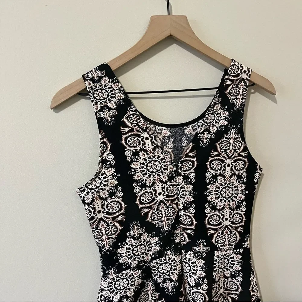 Lush  romper one piece Size small fun all over print sleeveless date